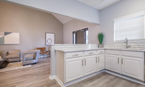 a kitchen with white cabinets