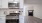 a kitchen with white cabinets