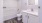 a bathroom with a tub, sink and toilet