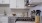 a kitchen with white cabinets